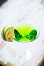Apple martini cocktail on the white rustic background Royalty Free Stock Photo