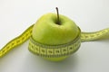 Apple with measuirng tape Royalty Free Stock Photo