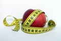 Apple with measuring tape Royalty Free Stock Photo