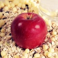 Apple on muesli background Royalty Free Stock Photo