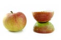 Apple in natural beauty and disfigured by cosmetic surgey Royalty Free Stock Photo
