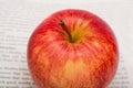 Apple on newspapers background Royalty Free Stock Photo