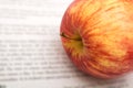 Apple on newspapers background Royalty Free Stock Photo