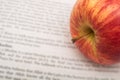 Apple on newspapers background Royalty Free Stock Photo