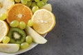 Apple, orange slices, green grapes, kiwi, lemon slices , fresh citrus and fruit Royalty Free Stock Photo