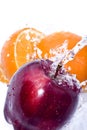 Apple and orange splash Royalty Free Stock Photo