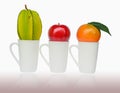 Apple, Orenge and Carambola put on the cup Royalty Free Stock Photo