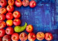 Apple with peach, nectarine, and pear on blue background, raw healhy food concept