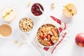 Apple peanut butter quinoa bowl with jam and cashew for healthy