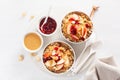 Apple peanut butter quinoa bowl with jam and cashew for healthy breakfast