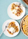 Apple and pear crumble with ice cream, streusel. Two plate with apple cobbler. Top view, vertical Royalty Free Stock Photo