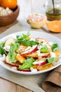 Apple with Persimmon and Feta salad Royalty Free Stock Photo