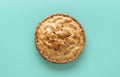Apple pie above view, isolated on a green background