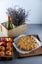 Apple pie and apples. Round homemade cake. Simple pastry made from shortcrust pastry and caramelized apple. Sweet pastries. Still Royalty Free Stock Photo