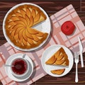 apple pie and cut piece in white plate, red tea in cup isolated on background of pink coral clotted towel on wooden table