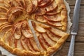 Apple pie, galette with a fruits, sweet pastries on old wooden rustic table. Part of pie, close up Royalty Free Stock Photo