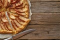 Apple pie, galette with a fruits, sweet pastries on old wooden rustic table. Part of pie, copy space Royalty Free Stock Photo