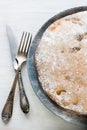 Apple pie is the gray plate, lying next fork and knife Royalty Free Stock Photo