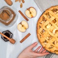 Apple pie, hands, apples, cinnamon, sugar, top view Royalty Free Stock Photo