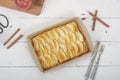Apple pie, ingredients - apples and cinnamon on white rustic wooden background - top view Royalty Free Stock Photo