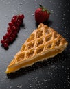 Apple pie slice on black table with currant and strawberry Royalty Free Stock Photo