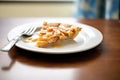 apple pie slice on a porcelain plate with a fork Royalty Free Stock Photo