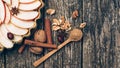 Apple pie tart. Homemade apple pie on rustic wooden background. Ingredients - apples, nuts, cinnamon and anise on table. Top view Royalty Free Stock Photo