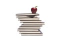 Apple and pile of books on white background Royalty Free Stock Photo