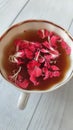 Apple pink flowers in a cup of tea