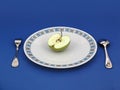 Apple on plate with silverware Royalty Free Stock Photo
