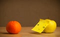 Apple with post-it note looking at orange