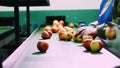 in an apple processing factory, workers in gloves sort apples. Ripe apples sorting by size and color, then packing Royalty Free Stock Photo