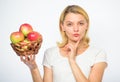 Apple recipes to make this fall. Girl hold basket apples white background. Culinary recipe concept. Woman thoughtful Royalty Free Stock Photo