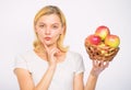 Apple recipes to make this fall. Girl hold basket apples white background. Culinary recipe concept. Woman thoughtful Royalty Free Stock Photo