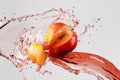 Apple and red juice splash isolated on a gray background Royalty Free Stock Photo