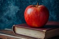 Apple resting atop a stack of books against a blue chalkboard background, AI-generated. Royalty Free Stock Photo