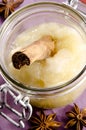 Apple sauce with a cinnamon stick Royalty Free Stock Photo