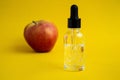 Apple-scented oil. Cosmetic serum with apple extract.