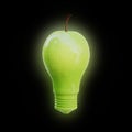 Apple shaped as a light bulb on black background