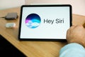 Apple Siri logo on the screen of iPad tablet. March 2021, San Francisco, USA