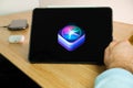 Apple Siri logo on the screen of iPad tablet. March 2021, San Francisco, USA