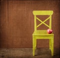 Apple sitting on classroom chair Royalty Free Stock Photo