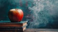 Apple sitting on top of a stack of books on top Royalty Free Stock Photo