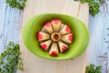 Apple slicer with red apple cutted into eight pieces on cutting board Royalty Free Stock Photo