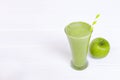 Apple smoothie green juice beverage healthy the taste yummy in glass for on white wood . Royalty Free Stock Photo