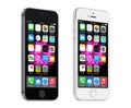 Apple Space Gray and Silver iPhone 5S displaying iOS 8, designed