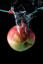 Apple spash in water on black Royalty Free Stock Photo