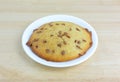 Apple spice muffin top on a plate atop a table