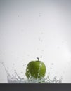 Apple splashing in water