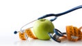 Apple stethoscope and tape measure isolated representing health and nutrition Royalty Free Stock Photo